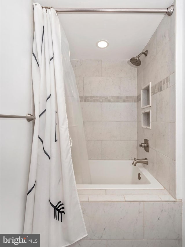 bathroom featuring shower / tub combo with curtain