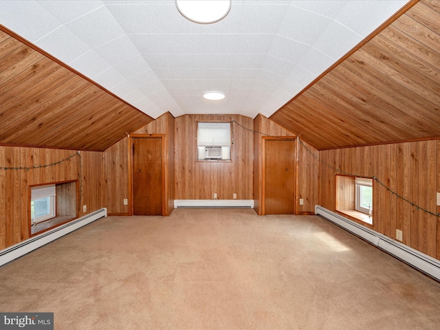 bonus room featuring a baseboard heating unit, wood walls, and vaulted ceiling