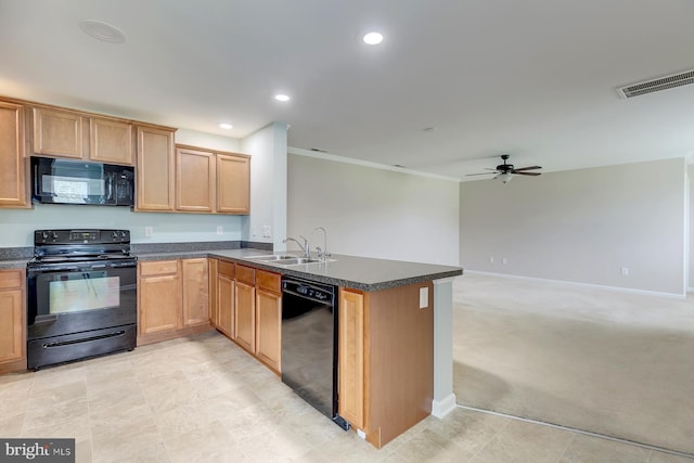 kitchen with visible vents, dark countertops, open floor plan, a peninsula, and black appliances