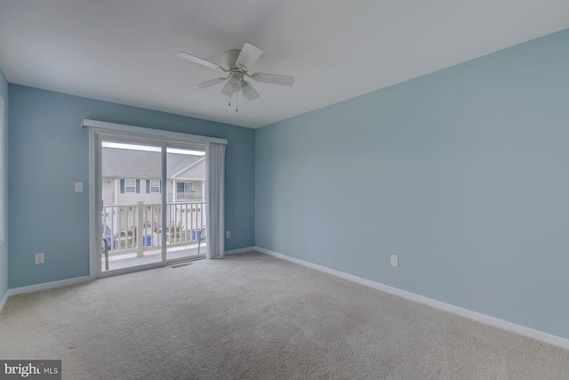 unfurnished room featuring a ceiling fan, carpet, visible vents, and baseboards