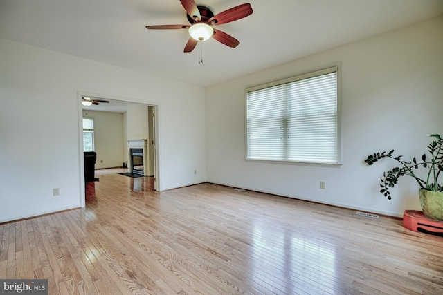 interior space with ceiling fan and light wood-type flooring