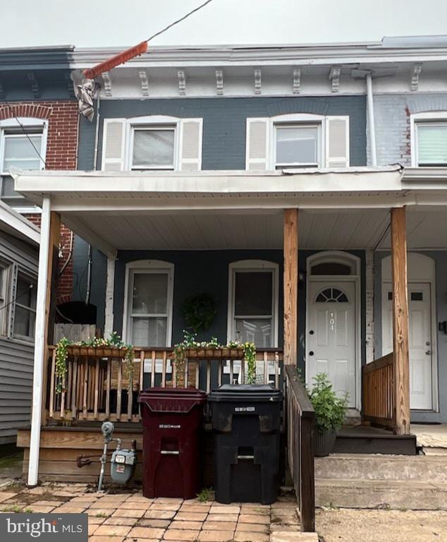 view of property with covered porch