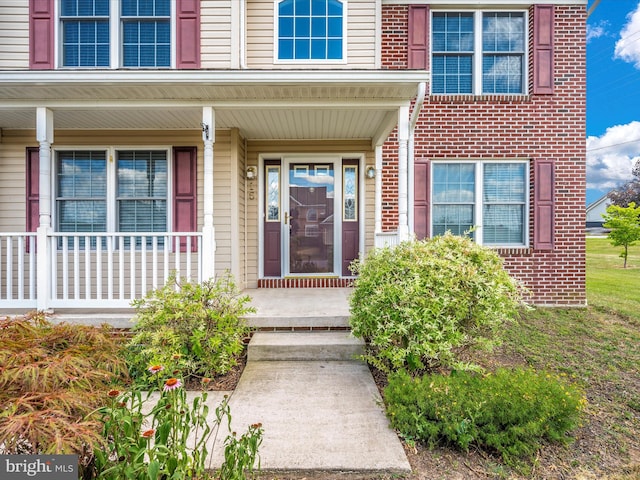 entrance to property with covered porch