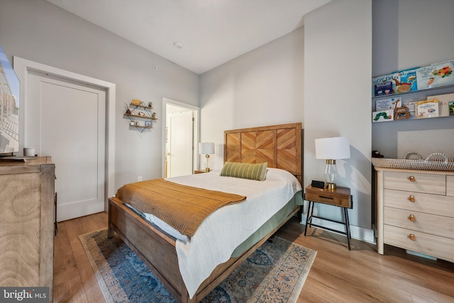 bedroom with light wood-style floors