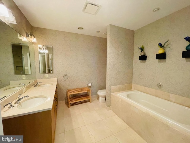 bathroom featuring toilet, tile patterned floors, vanity, a relaxing tiled tub, and heating unit