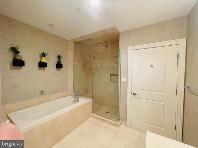 bathroom featuring independent shower and bath and tile patterned floors