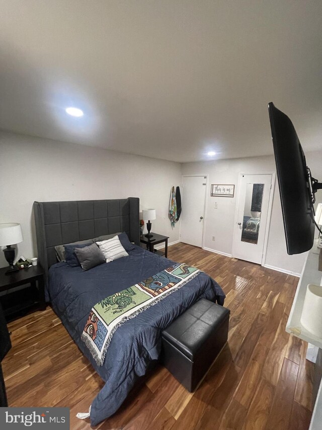 bedroom featuring dark wood-type flooring