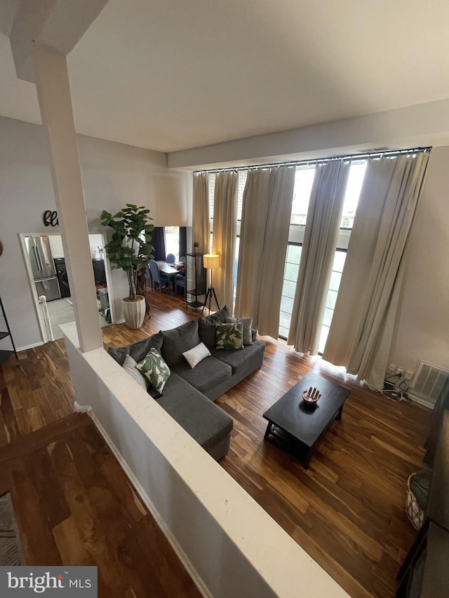 living room with dark hardwood / wood-style flooring