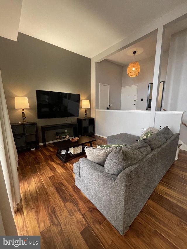 living room with dark wood-style flooring and baseboards