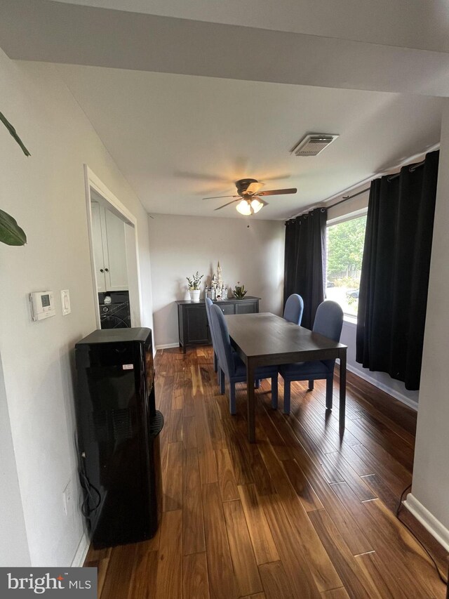 dining area featuring ceiling fan and dark hardwood / wood-style floors