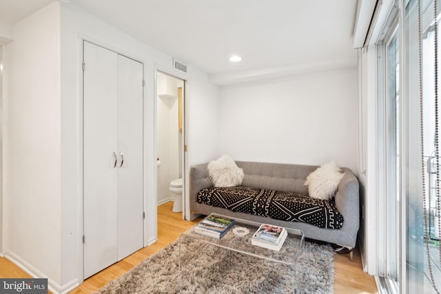 living area with light hardwood / wood-style floors