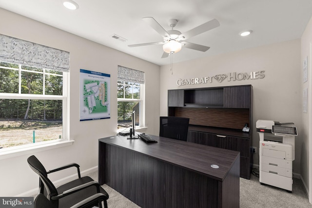 office with ceiling fan and light carpet