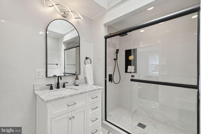 bathroom featuring an enclosed shower, crown molding, and vanity