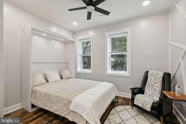 bedroom featuring ceiling fan and dark wood-type flooring