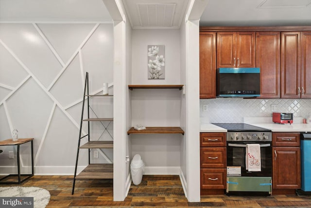 kitchen featuring backsplash, dark hardwood / wood-style floors, and stainless steel appliances