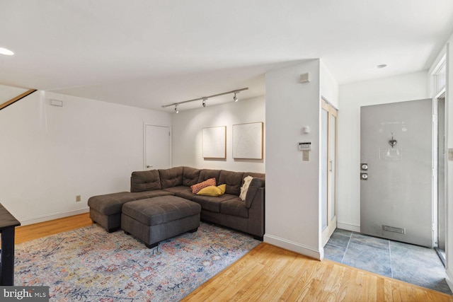 living room featuring track lighting and light wood-type flooring