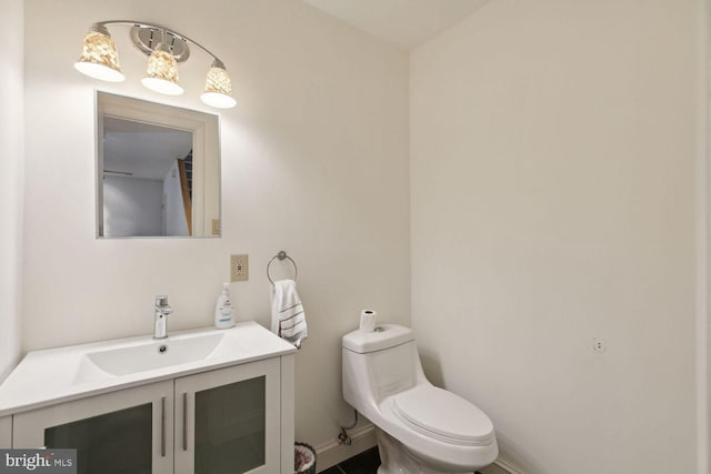 bathroom with toilet and vanity