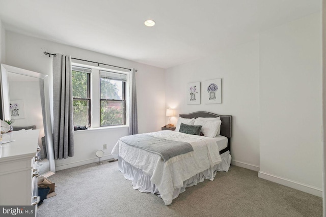 bedroom with light carpet