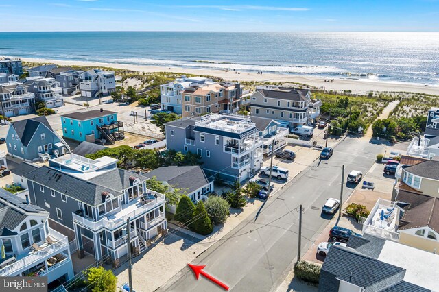 bird's eye view featuring a beach view and a water view