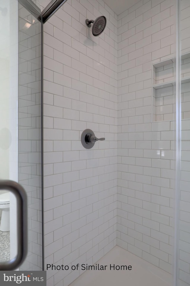 bathroom with a shower stall