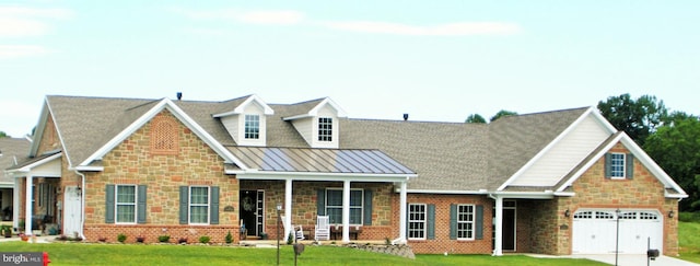 view of front of property featuring a garage and a front lawn