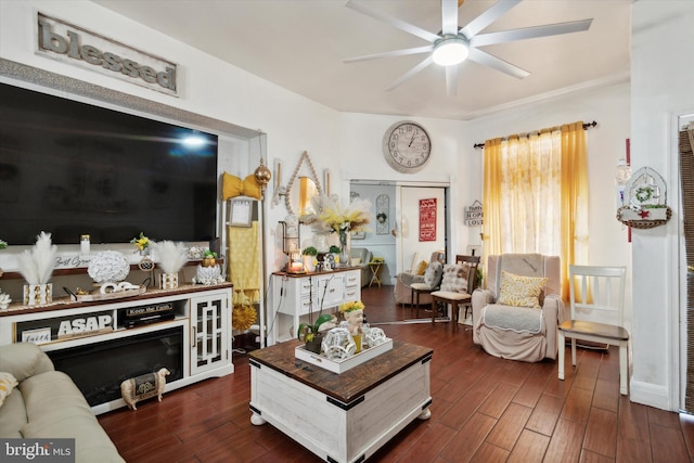 living room with dark wood-type flooring and ceiling fan