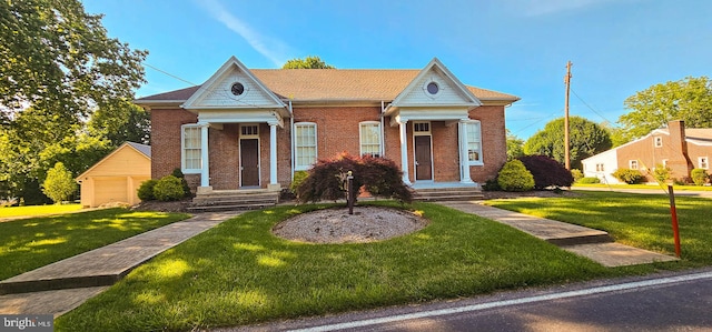 view of front of property with a front lawn and a garage