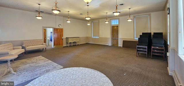 carpeted living room with a baseboard radiator