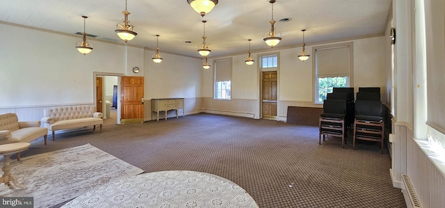 living room featuring dark colored carpet and baseboard heating