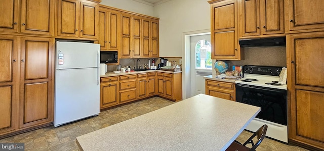 kitchen with decorative backsplash, black microwave, white fridge, and range with electric stovetop