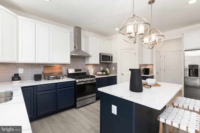 dining area with sink, an inviting chandelier, and a healthy amount of sunlight