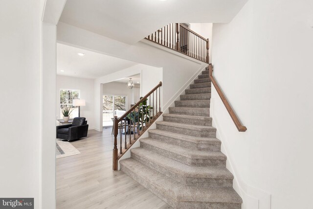 dining space with an inviting chandelier and hardwood / wood-style flooring