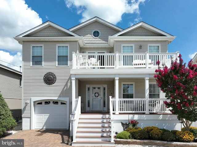 view of front of property with a garage and covered porch