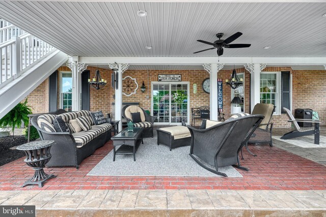 view of patio with an outdoor hangout area, stairs, and a ceiling fan