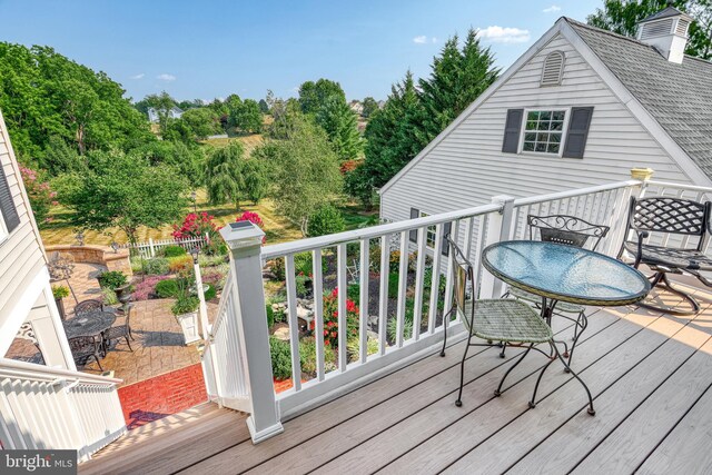 wooden deck featuring outdoor dining space