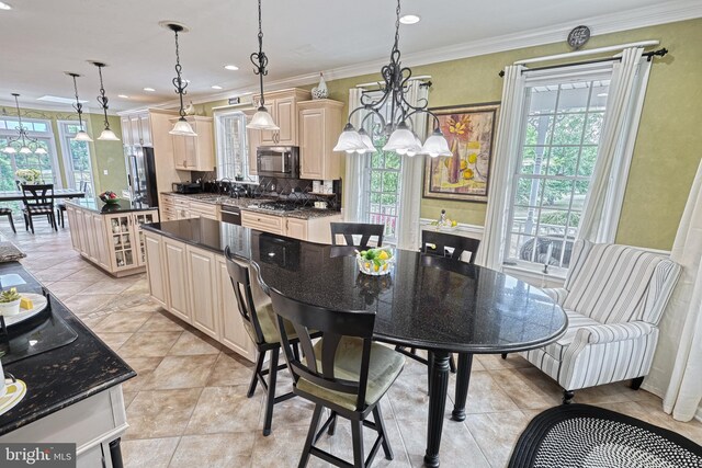 kitchen with pendant lighting, crown molding, stainless steel appliances, dark countertops, and glass insert cabinets