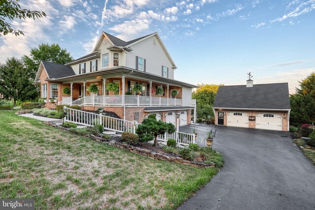 country-style home with covered porch, brick siding, and a front lawn