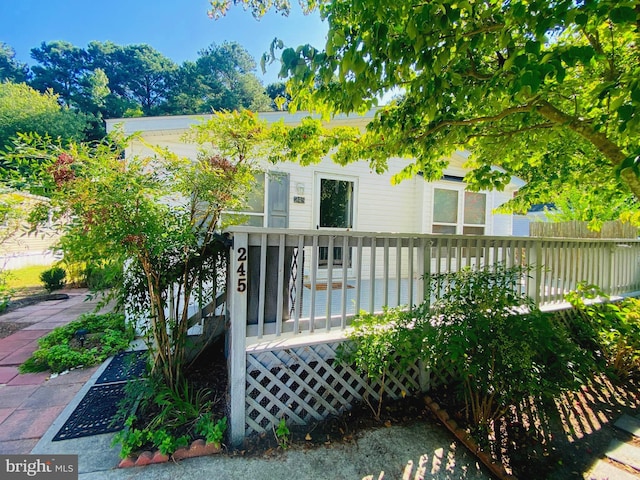 view of front of house with a wooden deck