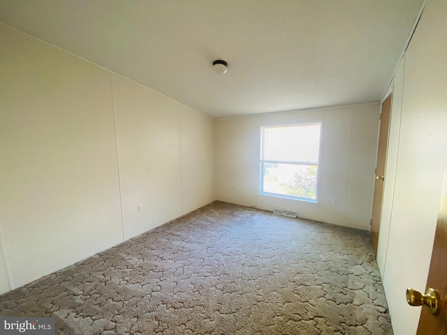 empty room featuring carpet floors