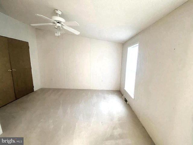 empty room with plenty of natural light and ceiling fan