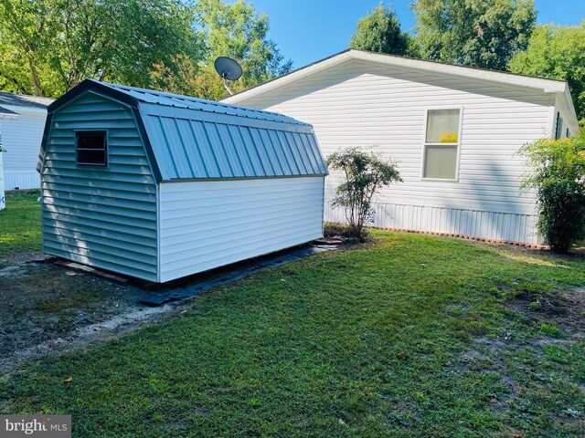 exterior space with a yard and a shed