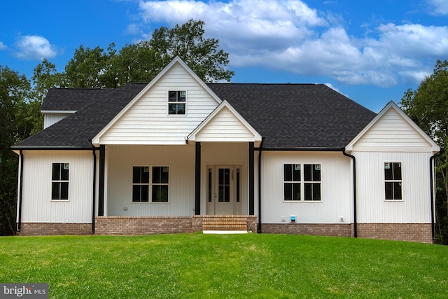 modern farmhouse style home with a front yard