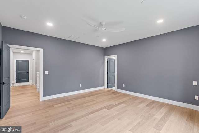 spare room with light hardwood / wood-style floors and ceiling fan