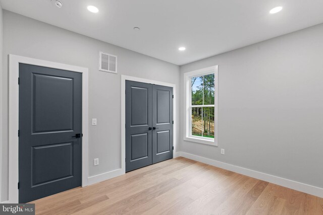 stairway featuring wood-type flooring