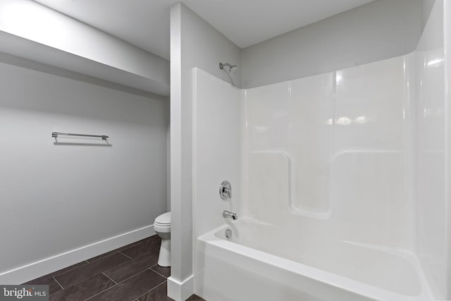 bathroom with toilet and shower / bathtub combination