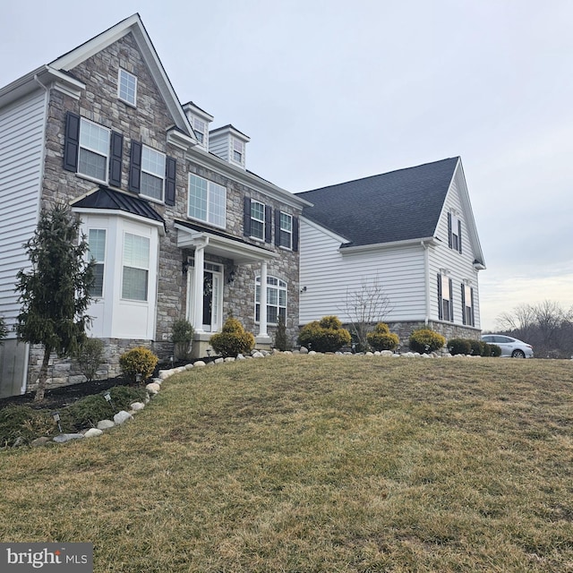 view of front property with a front yard