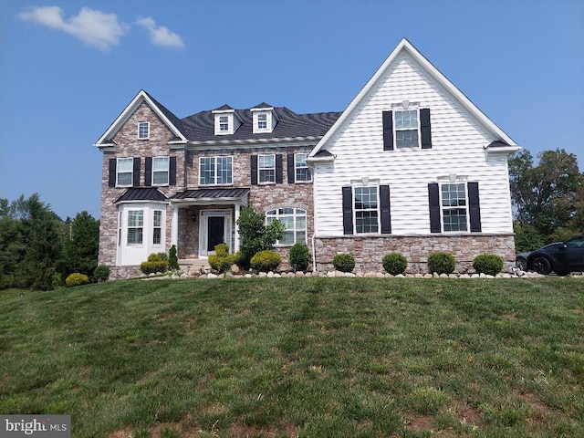 view of front facade with a front lawn