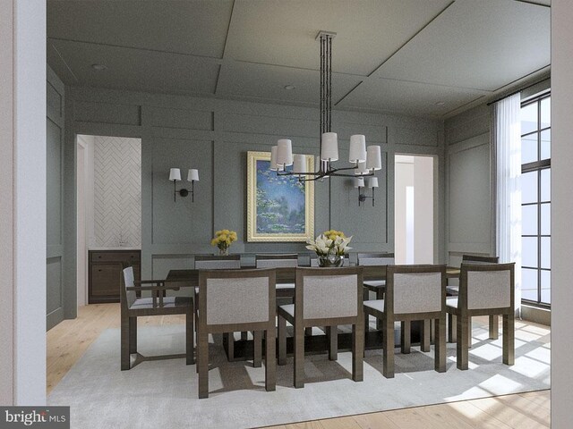 dining space featuring a notable chandelier and light wood-type flooring