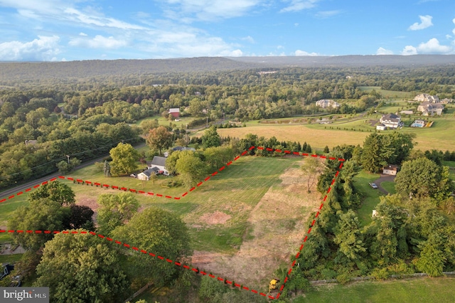 birds eye view of property featuring a rural view