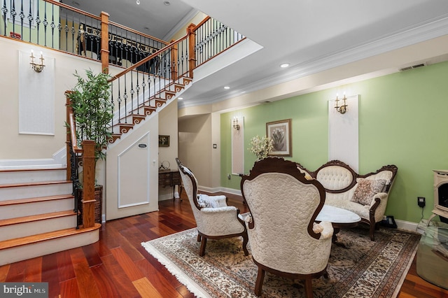 dining area with dark wood-type flooring, crown molding, stairway, and baseboards